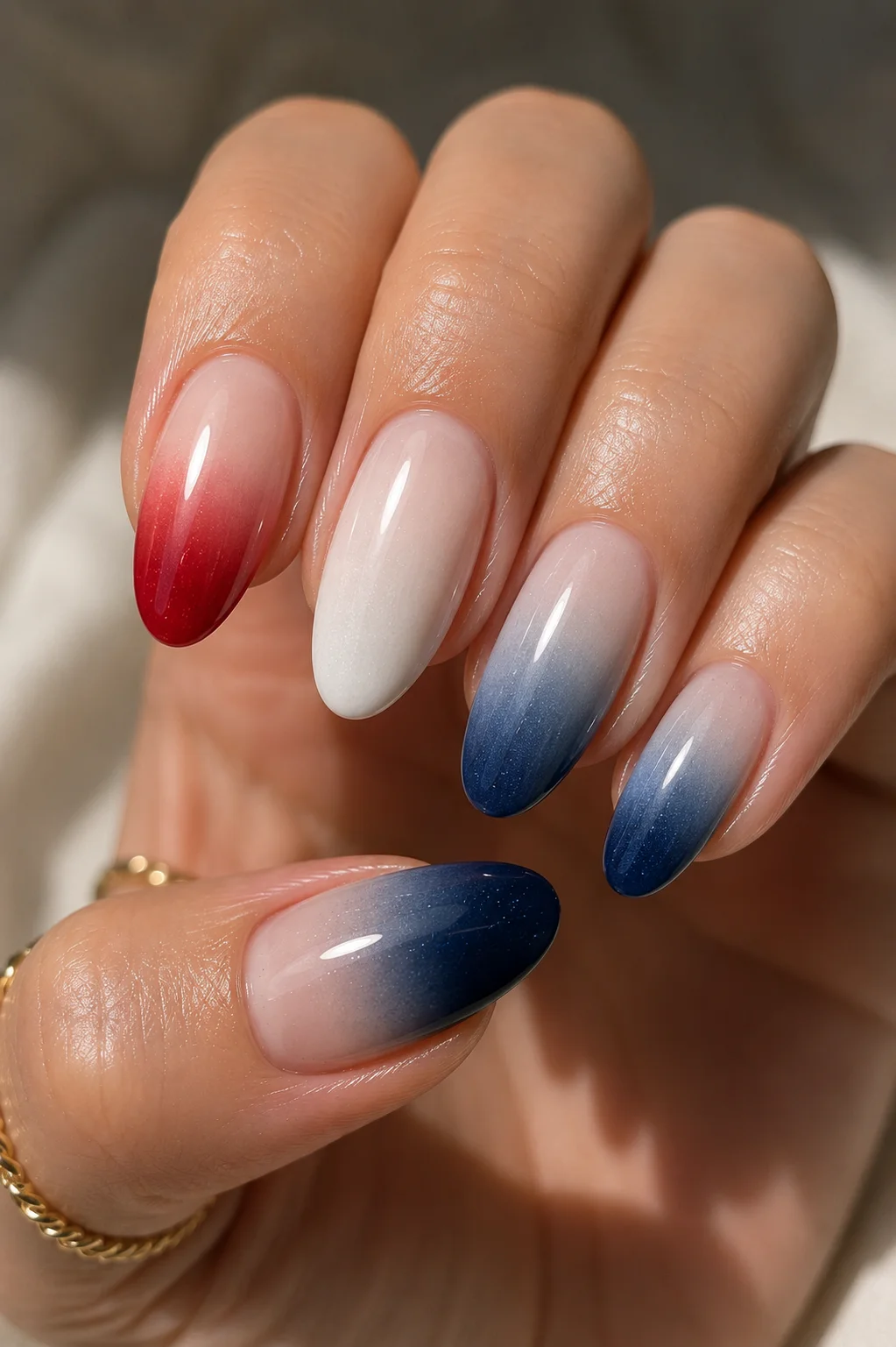 patriotic ombre nails red to sheer and navy to sheer ombre across five nails full hand fourth of July 2026