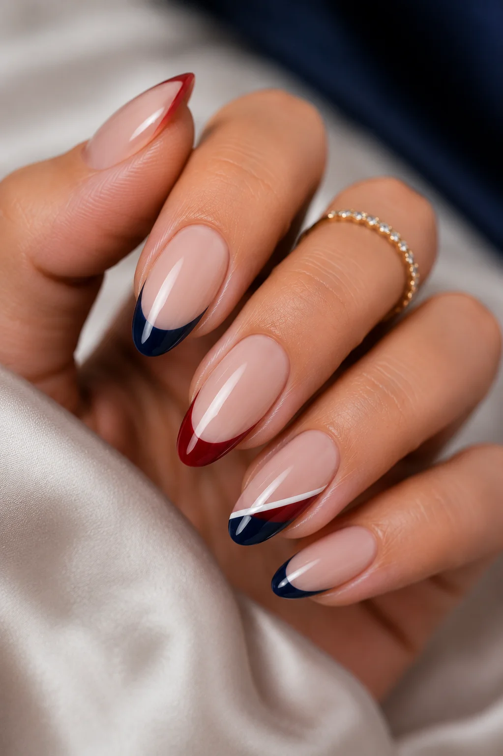 mixed red blue French tips alternating red navy tips sheer base split tip accent nail 4th of July 2026