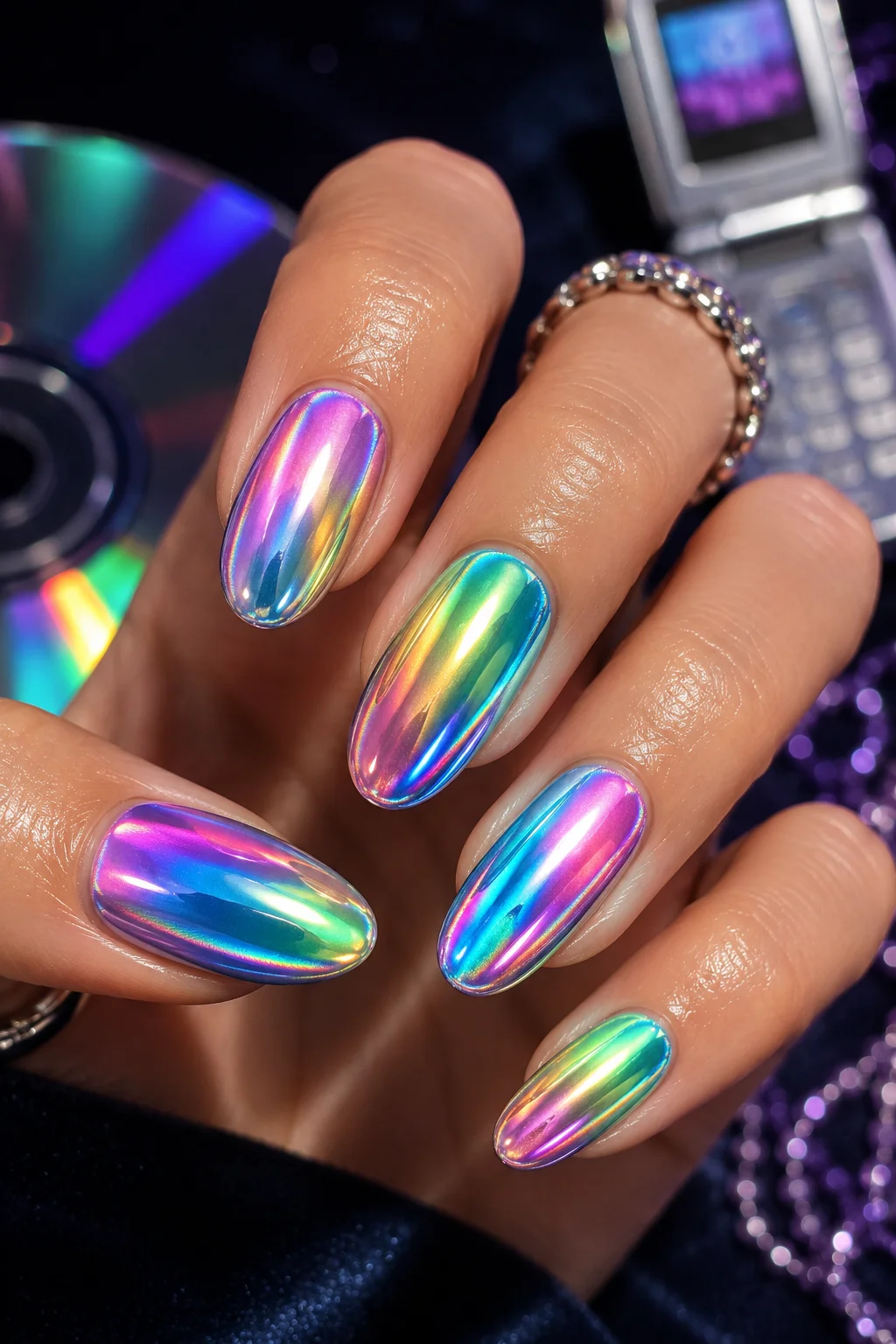 Y2K holographic chrome nails rainbow color shifting iridescent pink blue green oval almond 2026