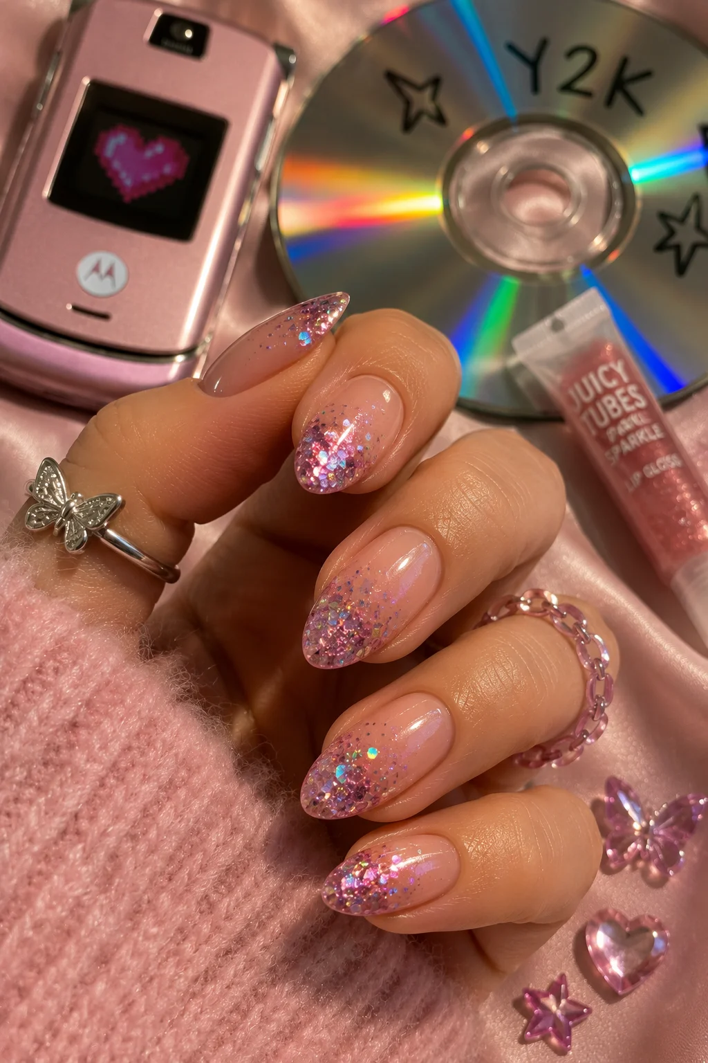Y2K glitter ombre nails chunky glitter sparse at base dense at tip pink gold gradient 2026